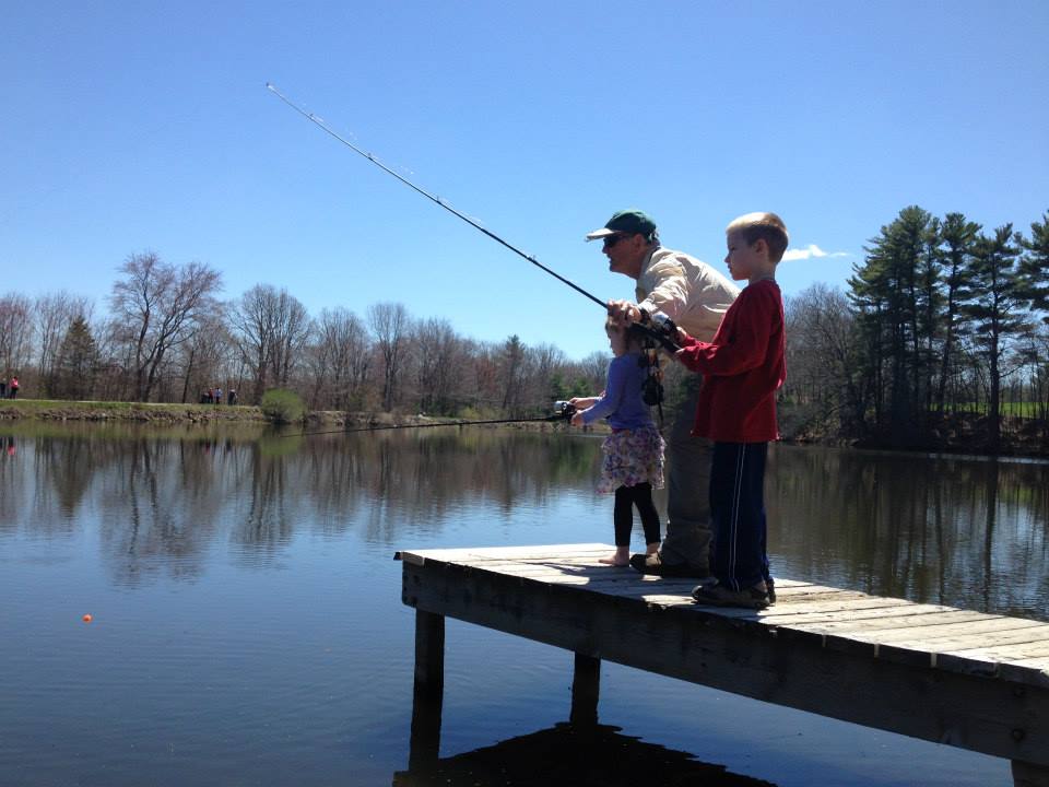 young boy and girl learning to fish.