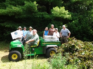 Crew of volunteers with pulled water chestnuts