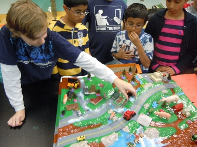 Students "pollute" model with road salt and other contaminants.