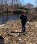 Boy picking up litter at Cleanup