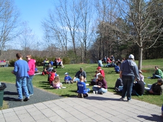 EarthDay Cleanup volunteers
            enjoying a pizza lunch at River Bend Farm.