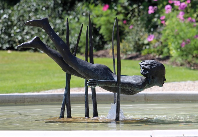 sculpture entitled girl over water.